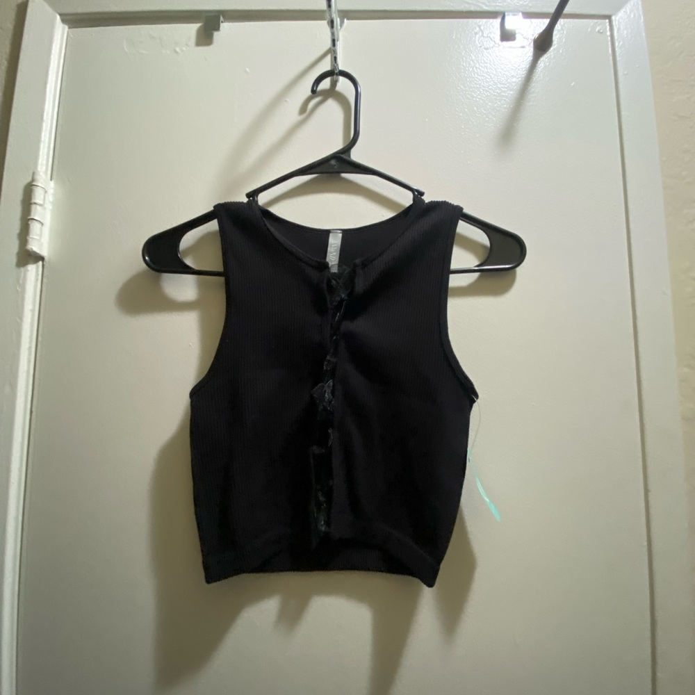 has ribbon lacing up the front